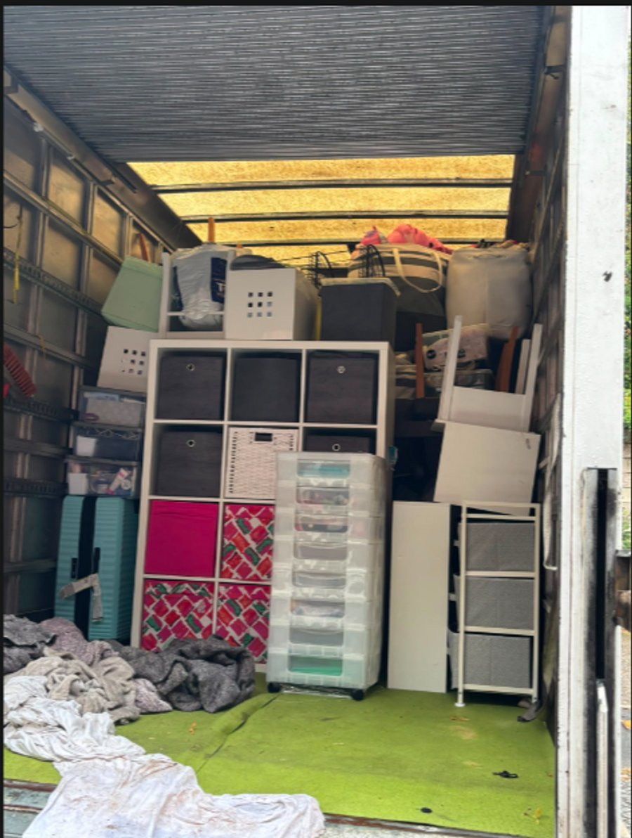 Household furniture carefully layered and wrapped with protective quilted transit blankets inside Jimmys Removals truck
